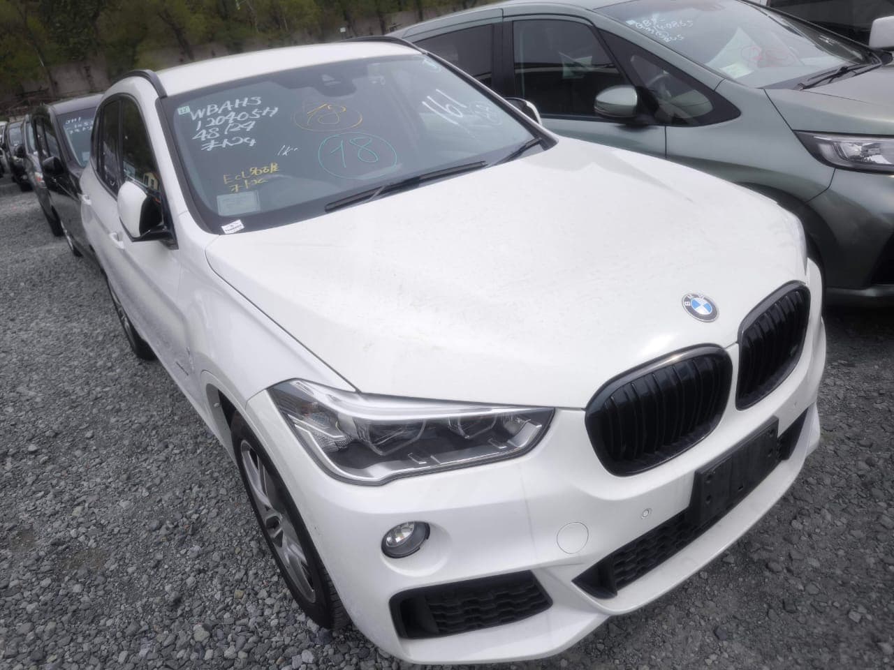 BMW X1 — импорт авто из Японии, Стоянка